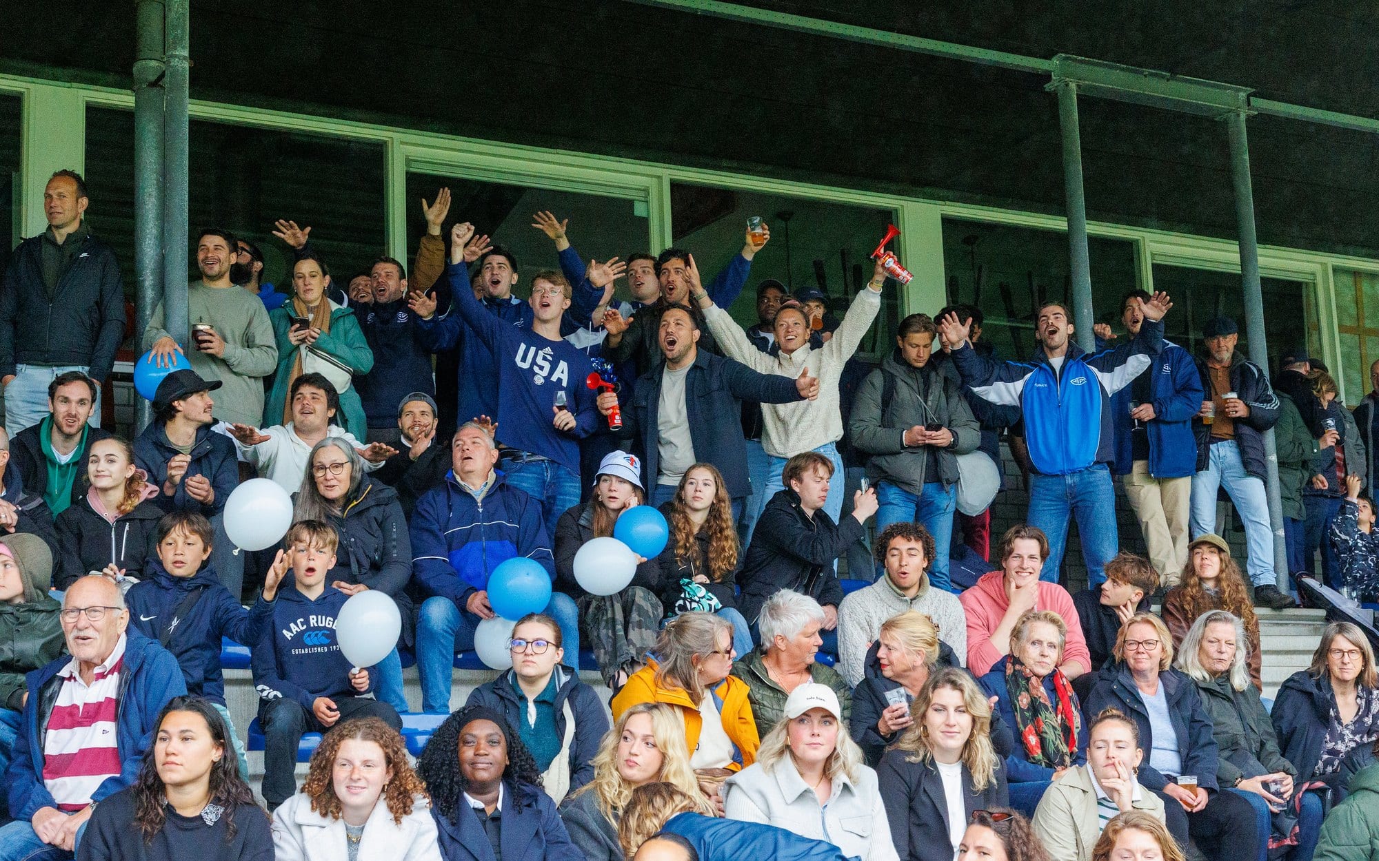 AAC supporters cheering from the stand on a match day at Sportpark De Eendracht