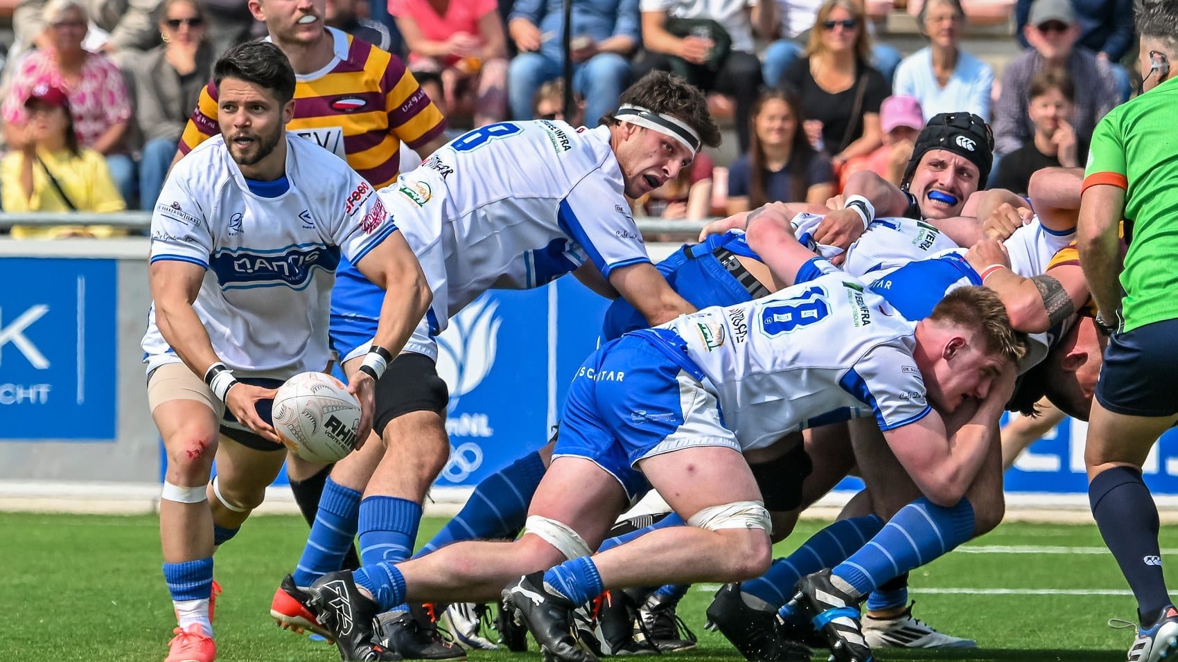 AAC scrum-half feeds the ball as the pack drives forward
