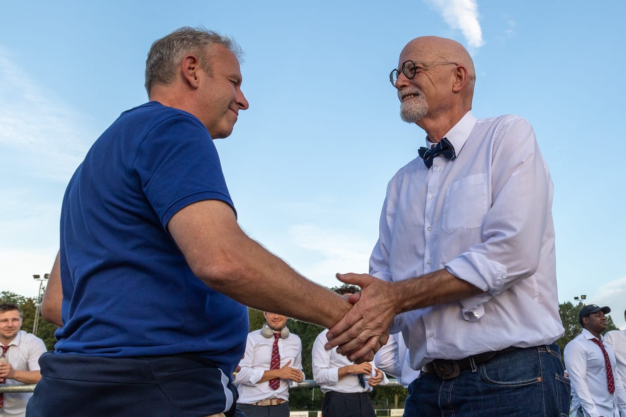 AAC members shake hands at the club