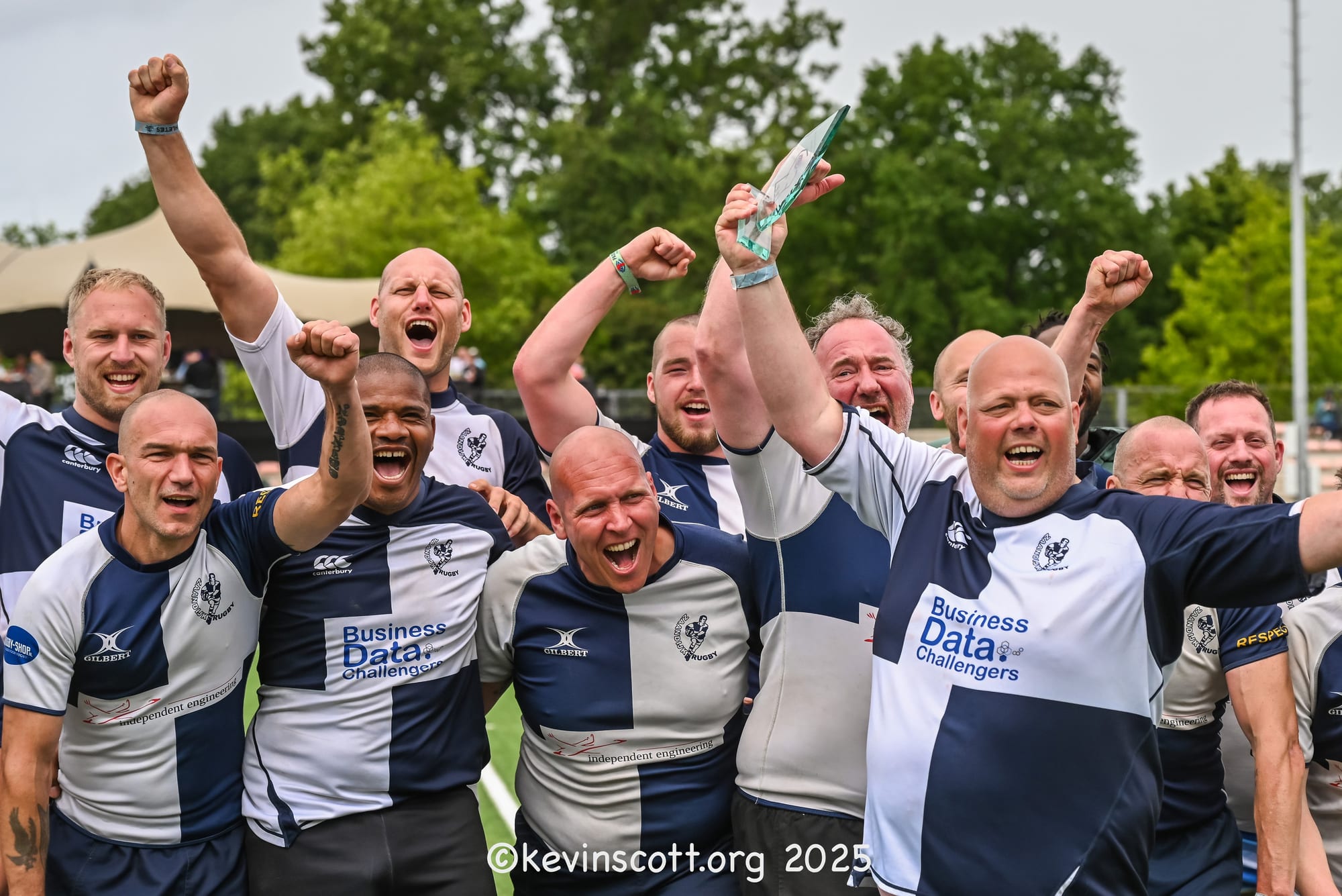 AAC veterans side celebrating with the trophy at the 2025 Amsterdam Sevens