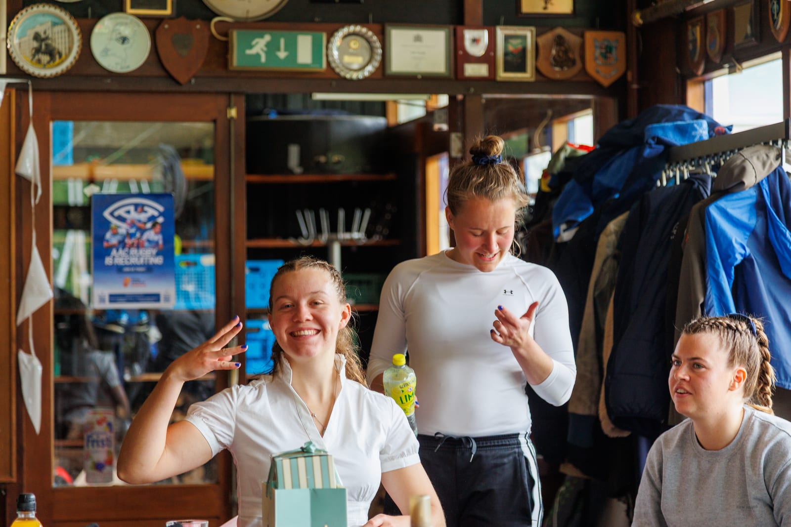 Players relaxing in the AAC clubhouse before the 2024–25 Dames Ereklasse final