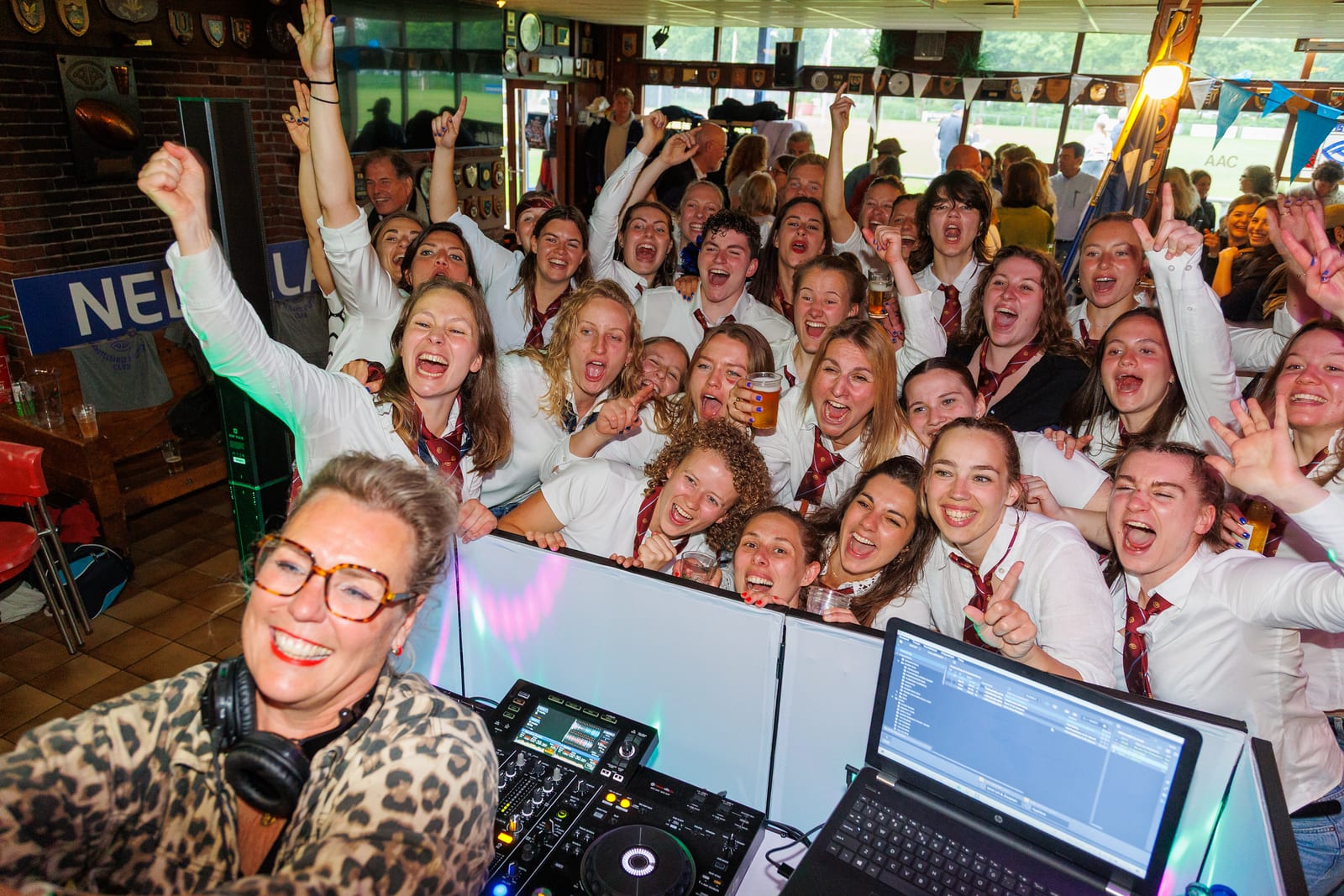 Champions night at the AAC clubhouse with the DJ and the Dames 1's piled in behind the decks