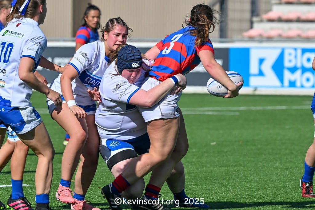 AAC forward in a scrum cap making a tackle against Utrecht URC