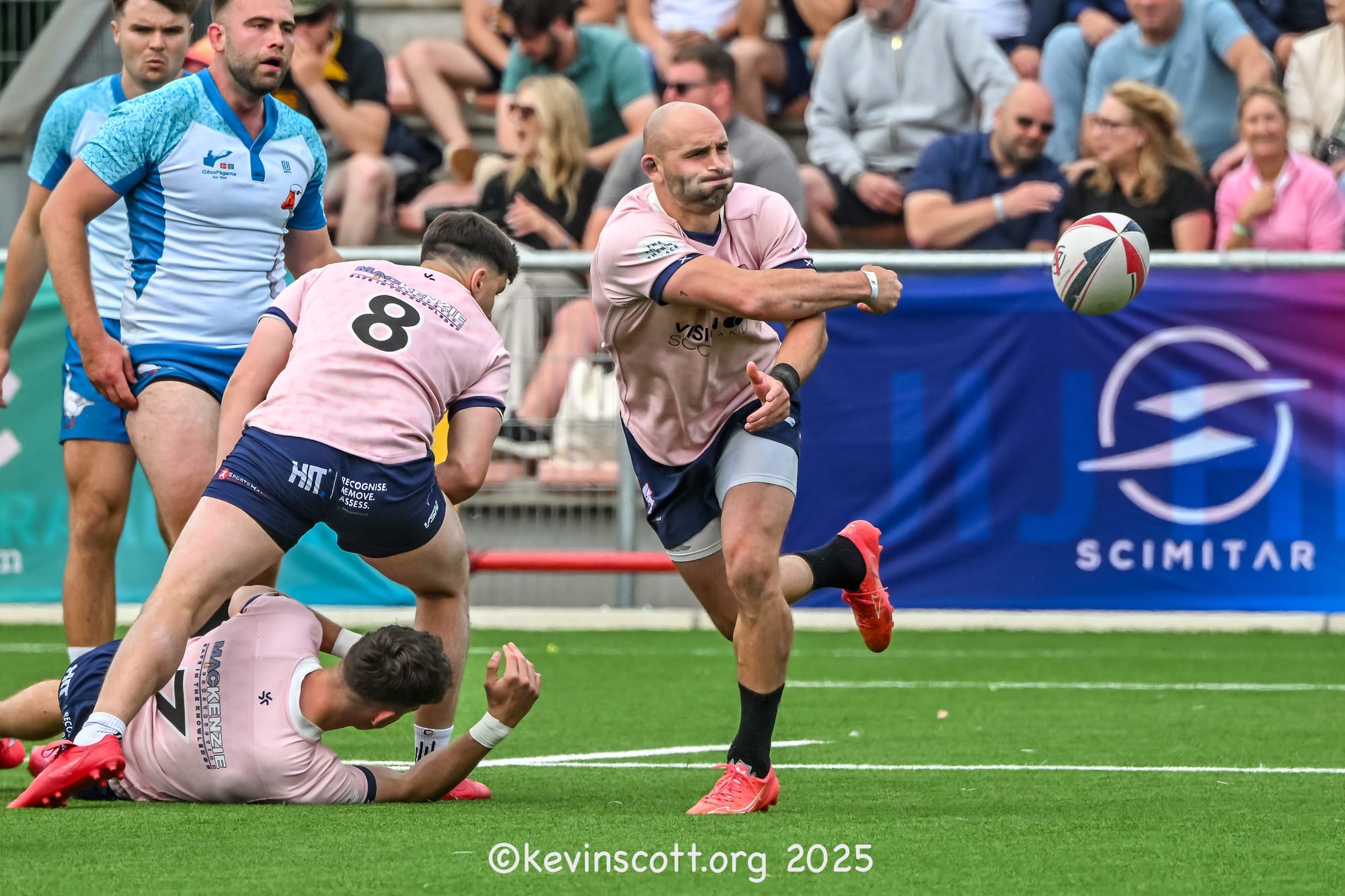 A GasaPagarna player offloads against Hearts & Balls Mighty Bovs at the 2025 Amsterdam Sevens