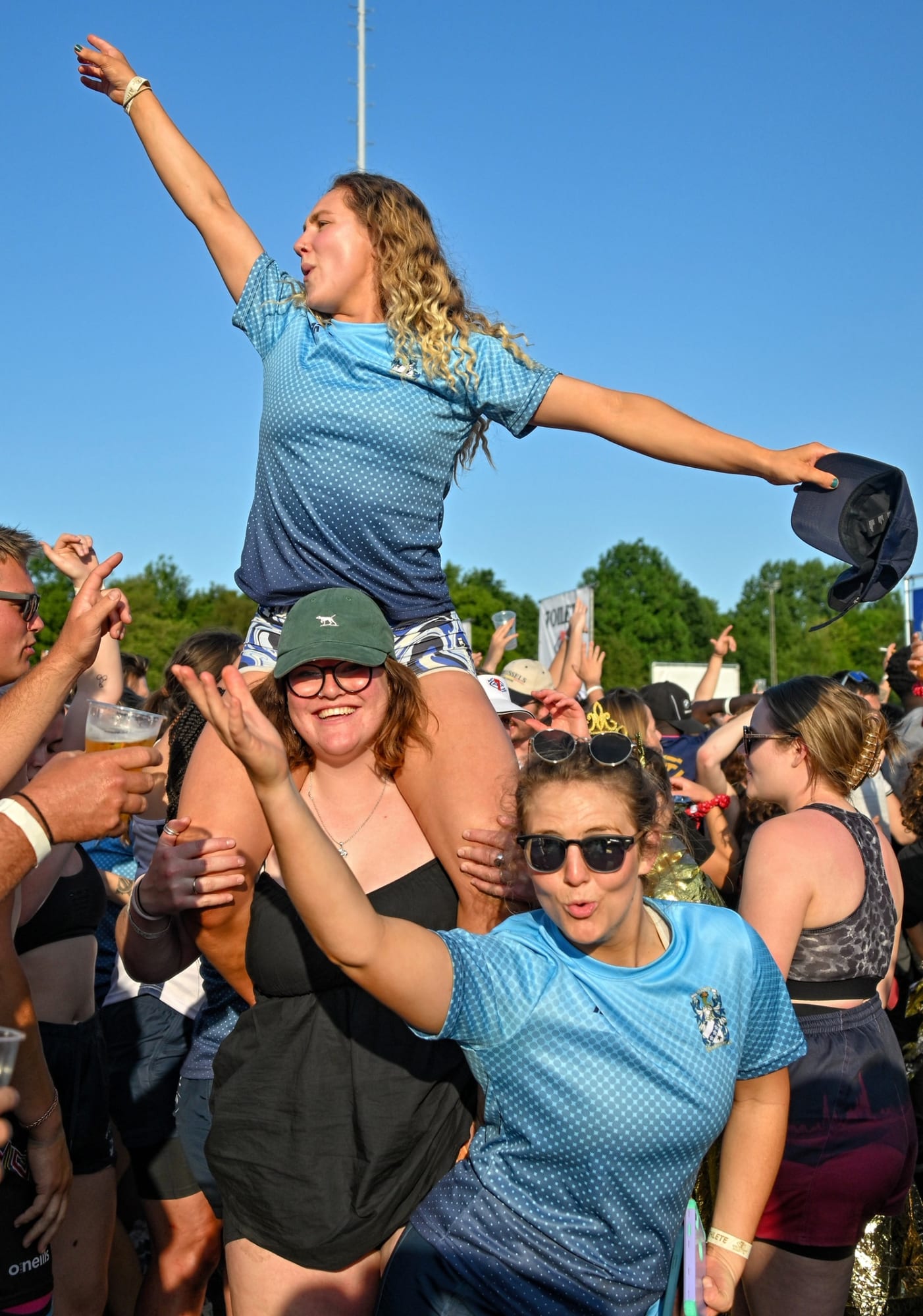 A player is hoisted onto shoulders in the crowd at the Amsterdam Sevens after-party