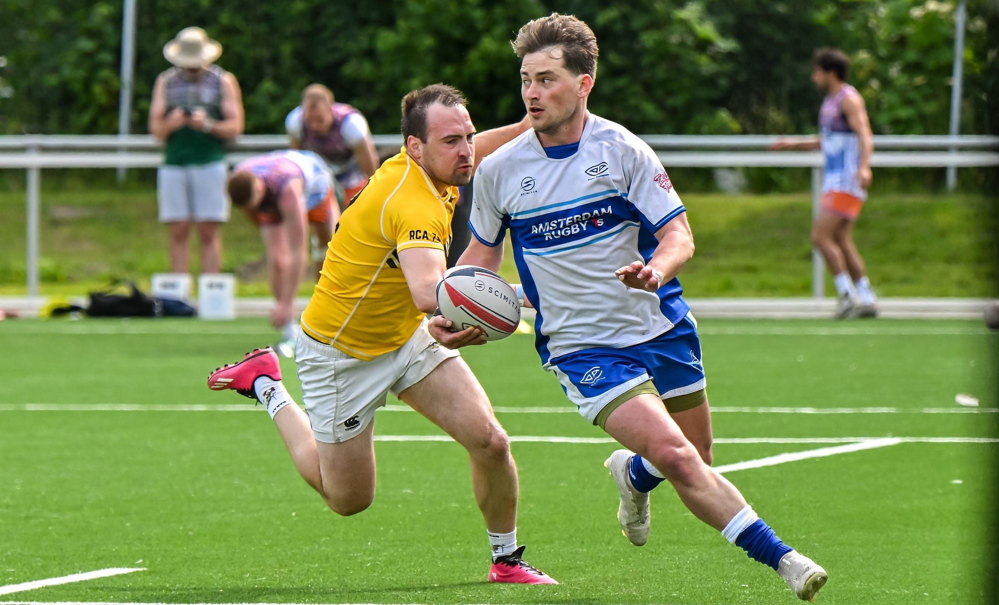 AAC sevens ball-carrier breaking past an Aachen RC defender at the Amsterdam Sevens